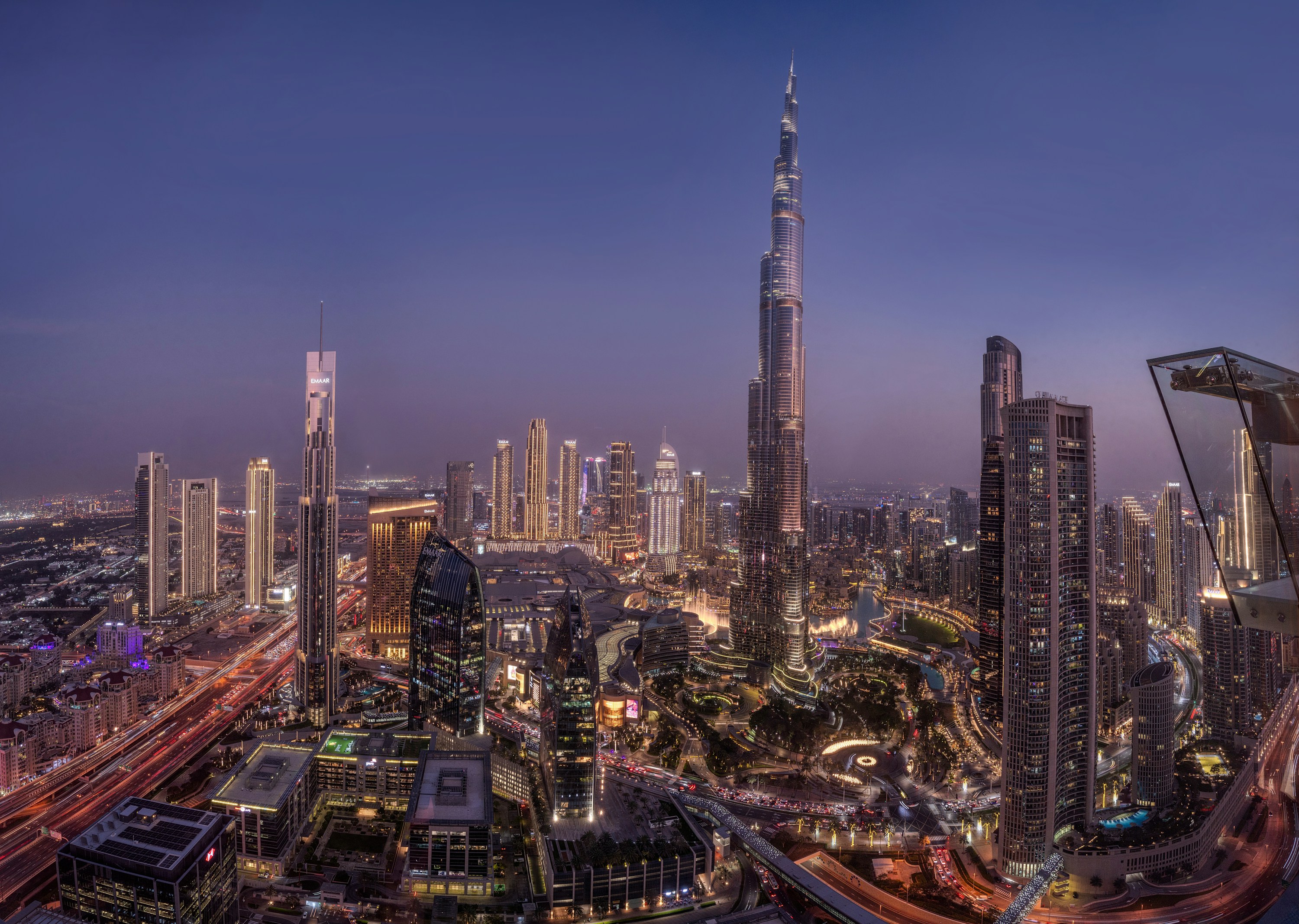 Dubai skyline and Burj Khalifa illuminated at blue hour